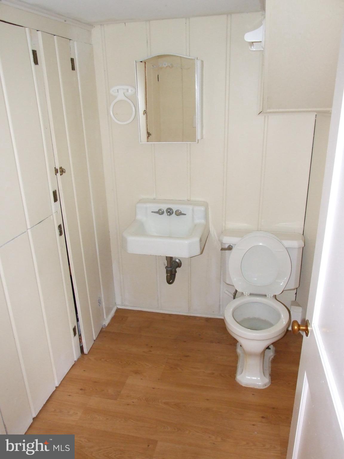 2941 Terrace Drive Chevy Chase, MD 20815 - Photo 20 of 24 a bathroom with a toilet and a sink