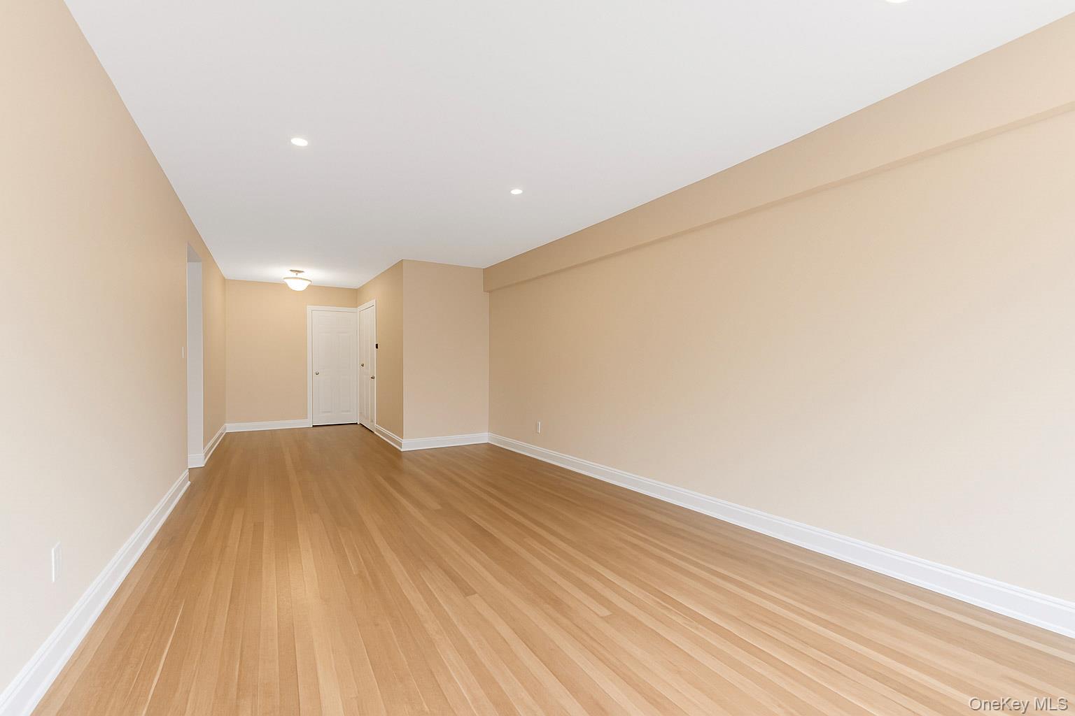 609 Palmer Road, Unit 4J Yonkers, NY 10701 - Photo 15 of 26 a view of empty room with wooden floor