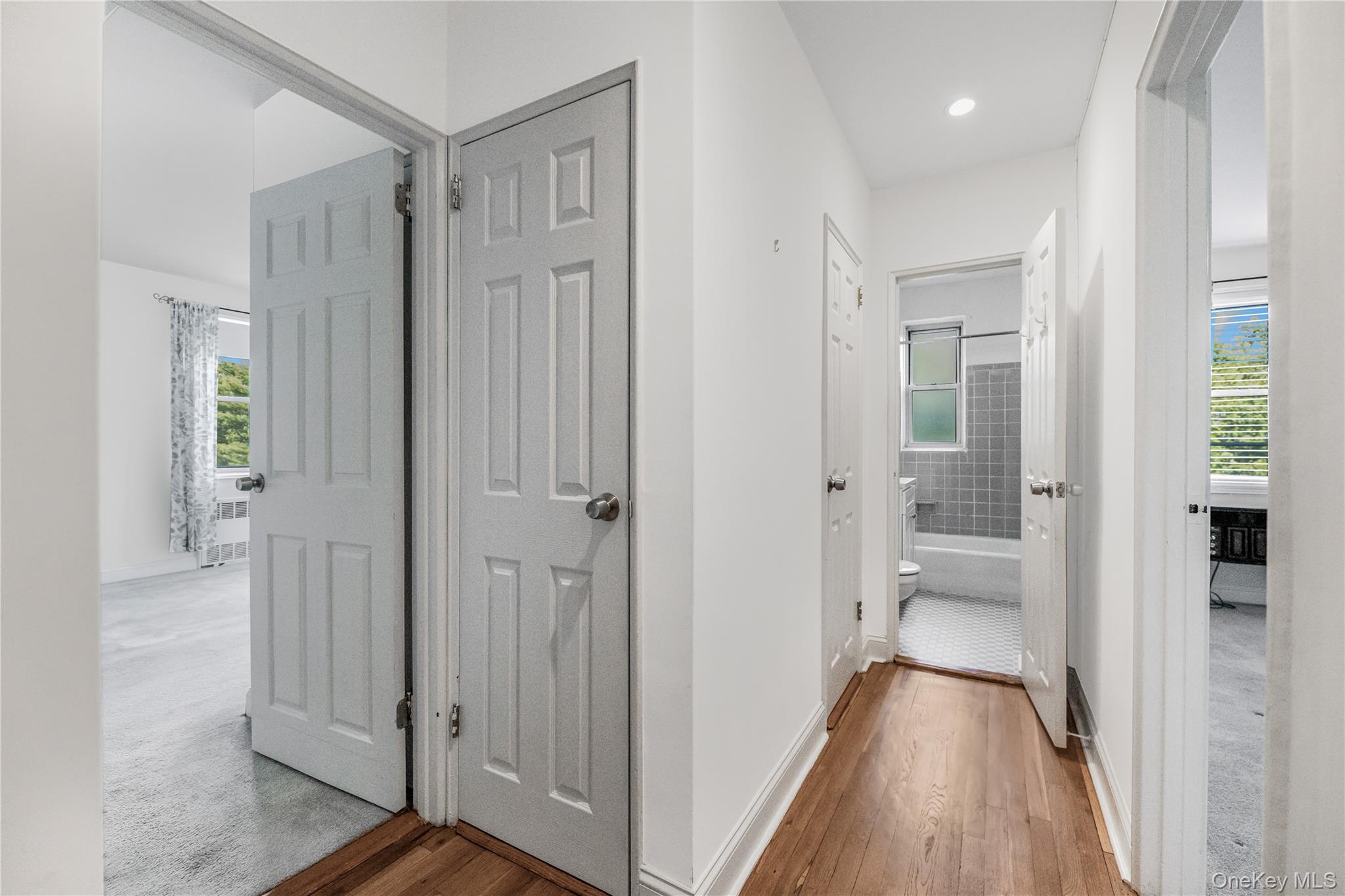 609 Palmer Road, Unit 4J Yonkers, NY 10701 - Photo 16 of 26 a view of a bathroom with a glass door shower