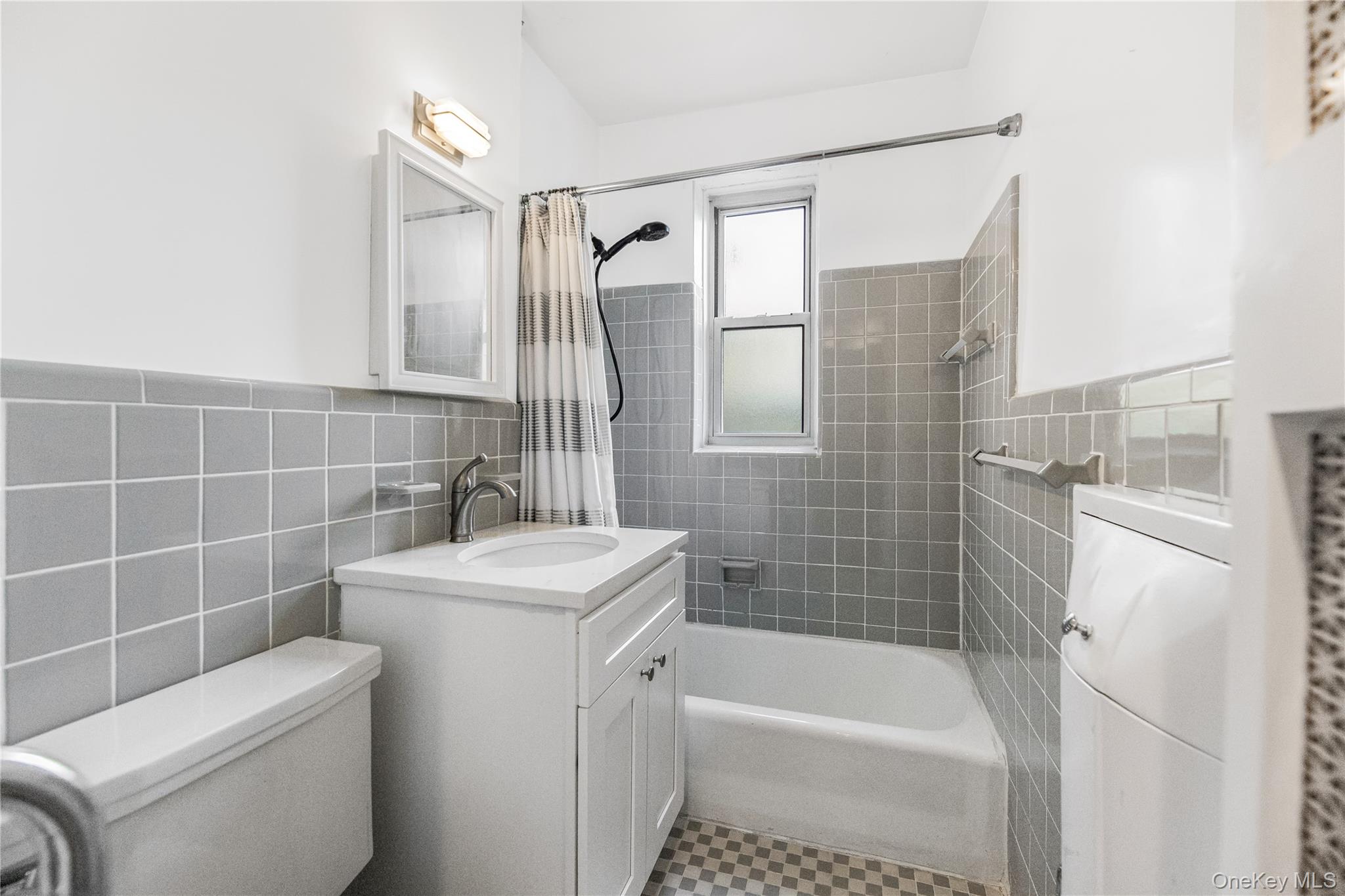 609 Palmer Road, Unit 4J Yonkers, NY 10701 - Photo 20 of 26 a bathroom with a sink toilet and shower