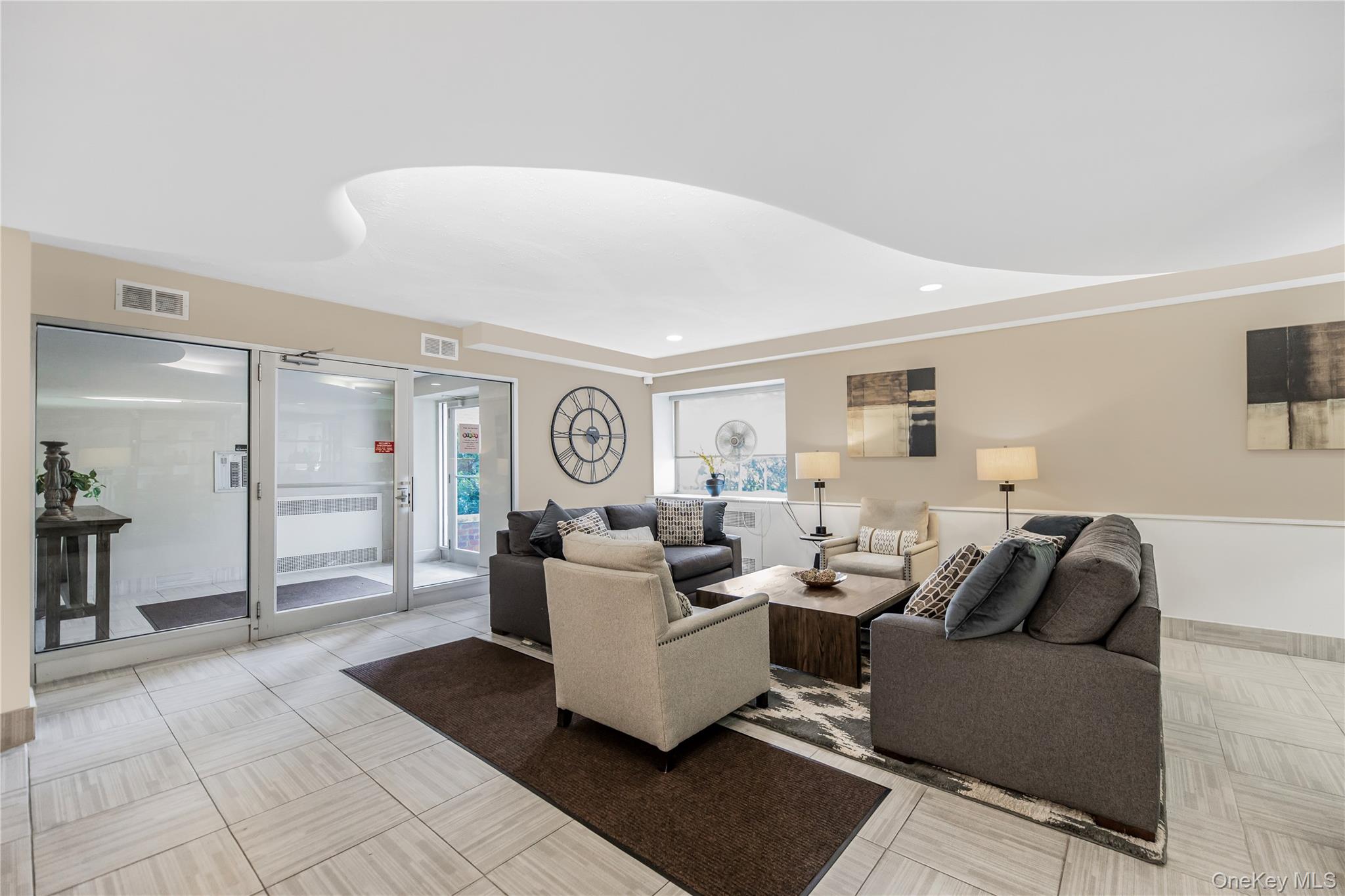 609 Palmer Road, Unit 4J Yonkers, NY 10701 - Photo 7 of 26 a living room with furniture and a window