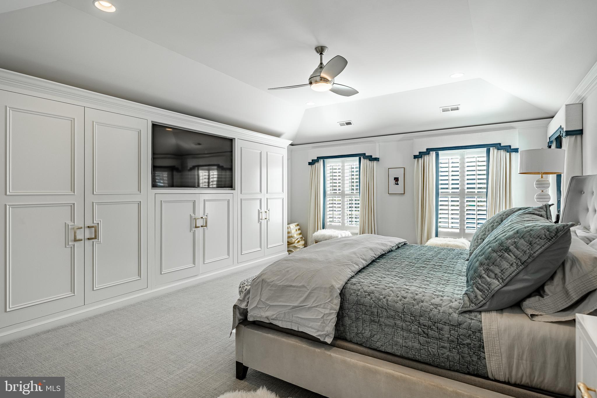 1053 Whitegate Road Wayne, PA 19087 - Photo 21 of 51 a bedroom with a large bed a flat tv screen and a walk in closet