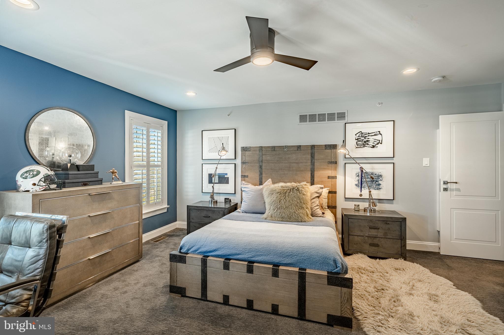 1053 Whitegate Road Wayne, PA 19087 - Photo 26 of 51 a bedroom with a bed and wooden floor