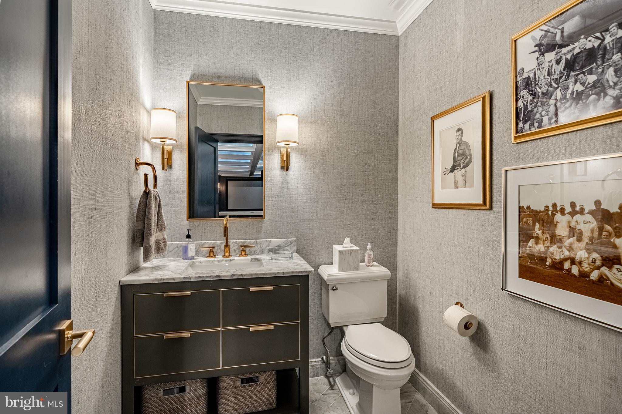 1053 Whitegate Road Wayne, PA 19087 - Photo 34 of 51 a bathroom with a toilet sink and mirror