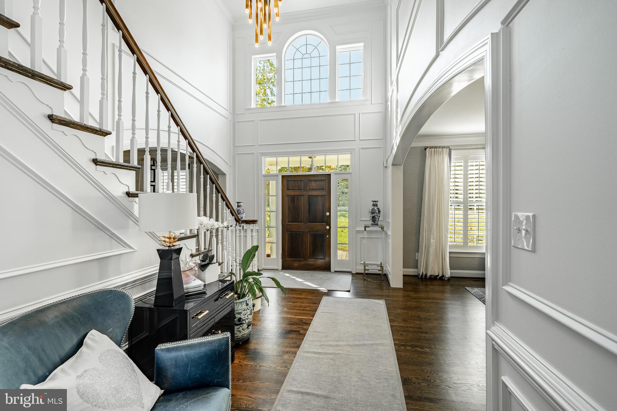 1053 Whitegate Road Wayne, PA 19087 - Photo 5 of 51 a hallway with wooden floor and stairs