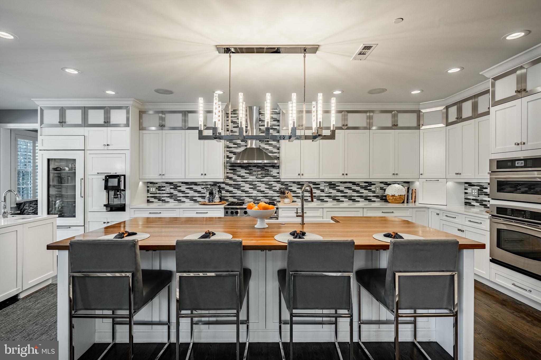 1053 Whitegate Road Wayne, PA 19087 - Photo 9 of 51 a dining table with chairs and kitchen view