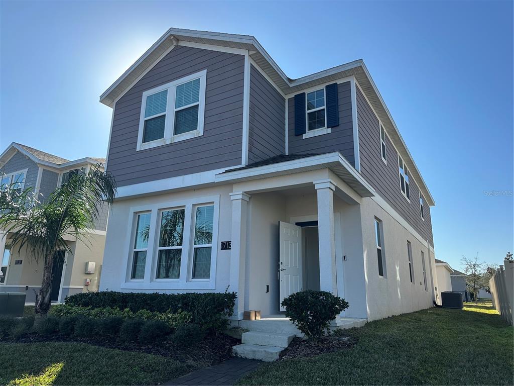 17136 Salty Dog Road Winter Garden, FL 34787 - Photo 1 of 38 a front view of a house with garden