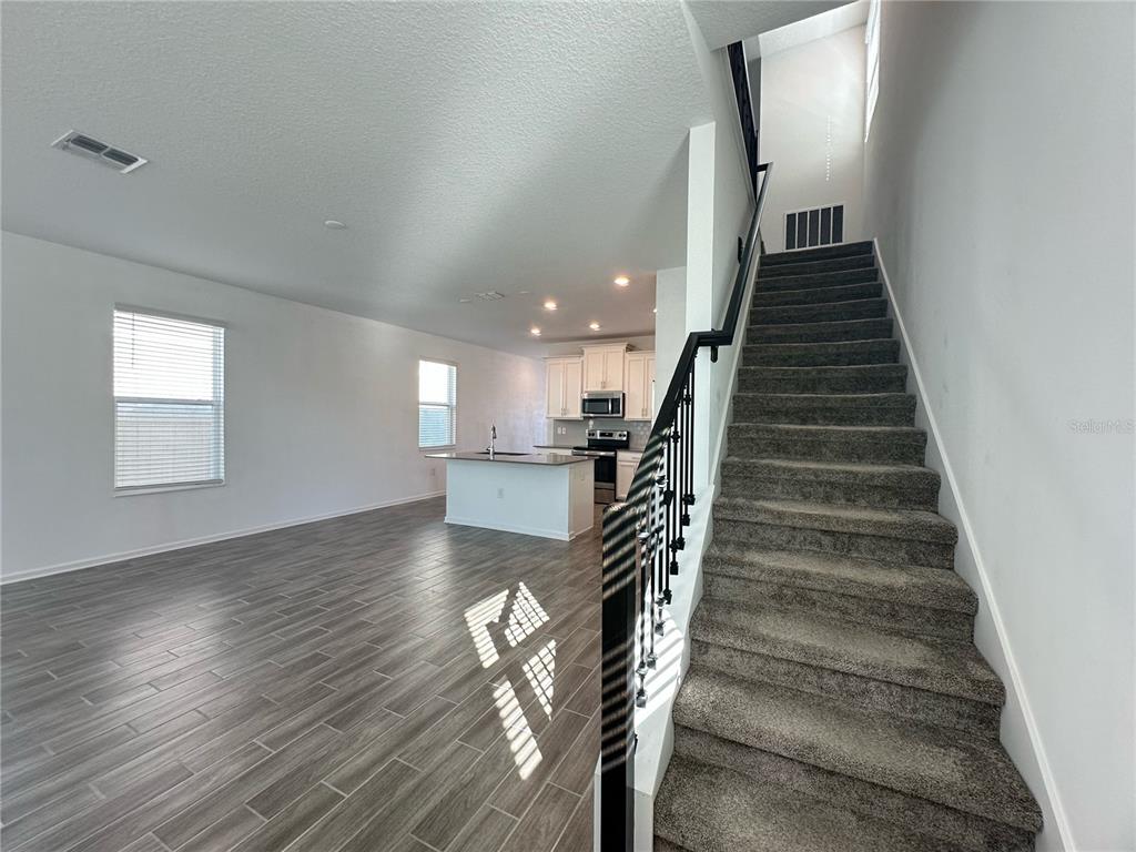 17136 Salty Dog Road Winter Garden, FL 34787 - Photo 13 of 38 a view of entryway and hall with wooden floor