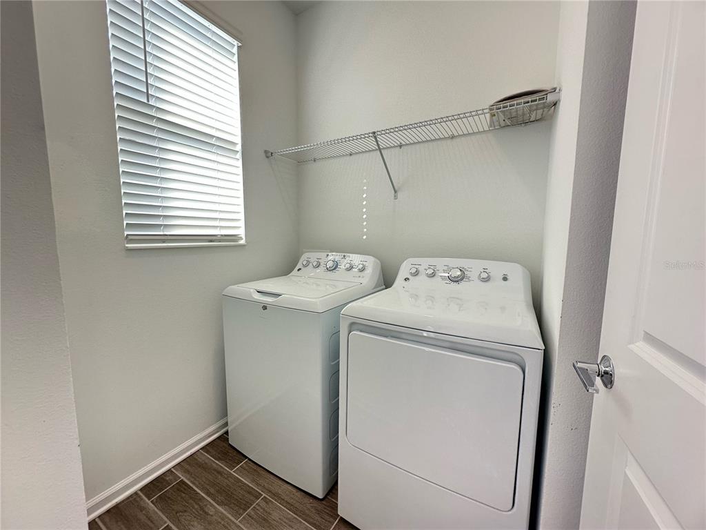 17136 Salty Dog Road Winter Garden, FL 34787 - Photo 16 of 38 a utility room with dryer and washer