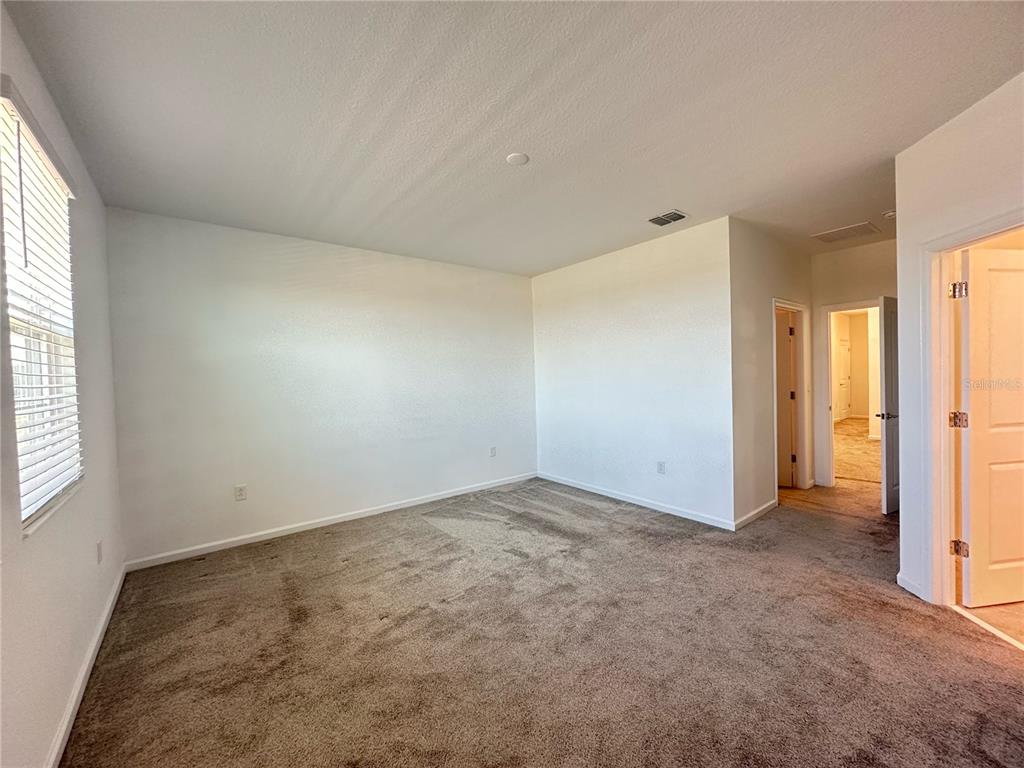 17136 Salty Dog Road Winter Garden, FL 34787 - Photo 18 of 38 an empty room with windows