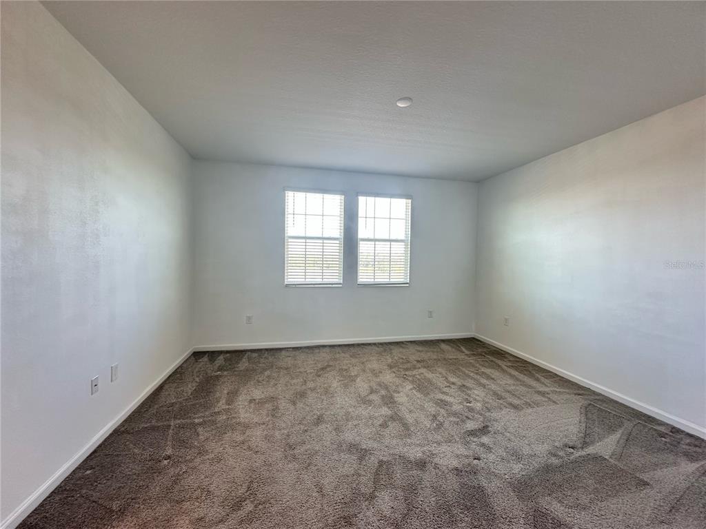 17136 Salty Dog Road Winter Garden, FL 34787 - Photo 19 of 38 an empty room with a window