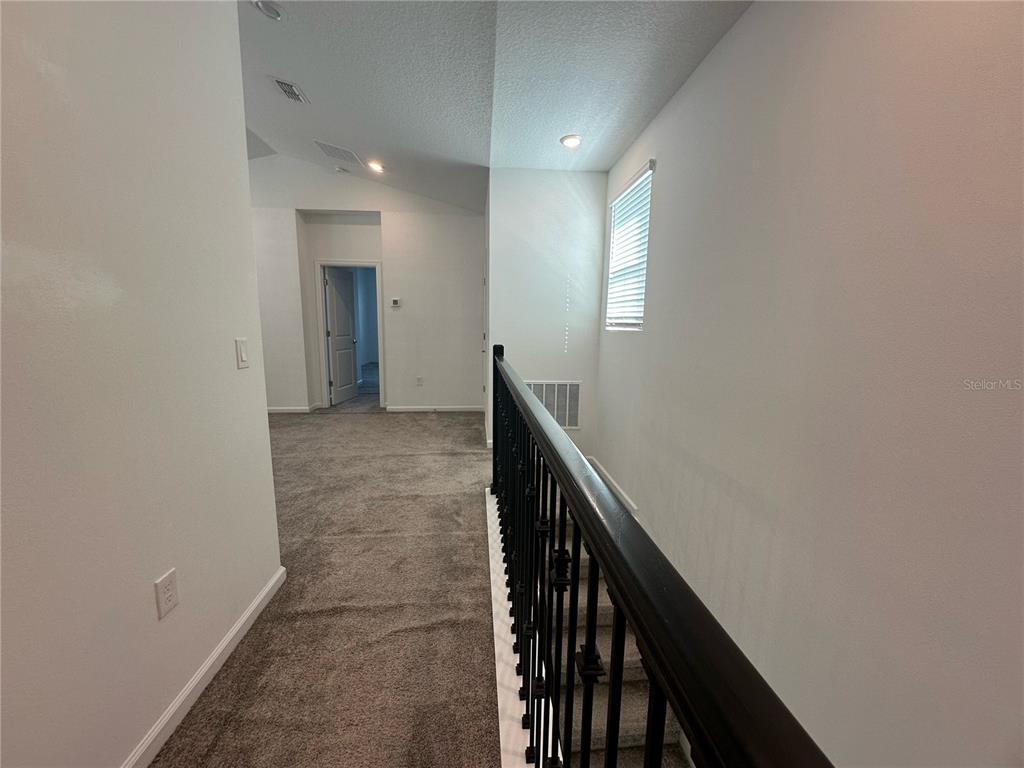17136 Salty Dog Road Winter Garden, FL 34787 - Photo 23 of 38 a view of hallway with stairs