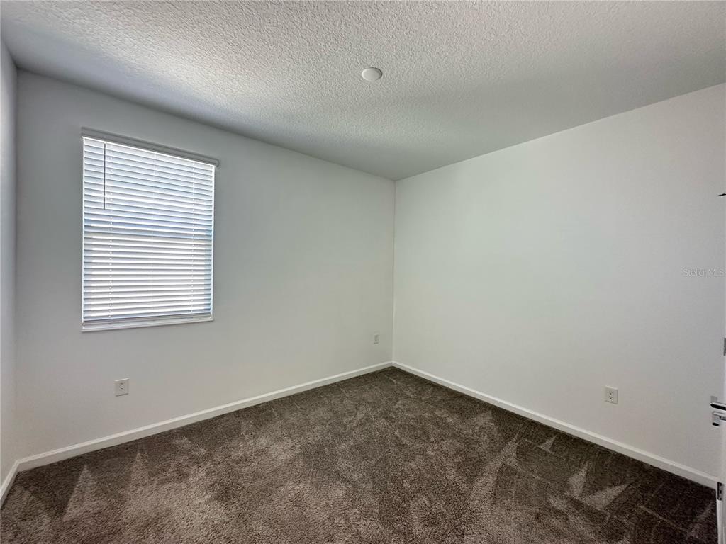 17136 Salty Dog Road Winter Garden, FL 34787 - Photo 24 of 38 an empty room with a window