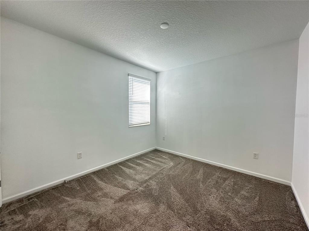 17136 Salty Dog Road Winter Garden, FL 34787 - Photo 27 of 38 an empty room with windows