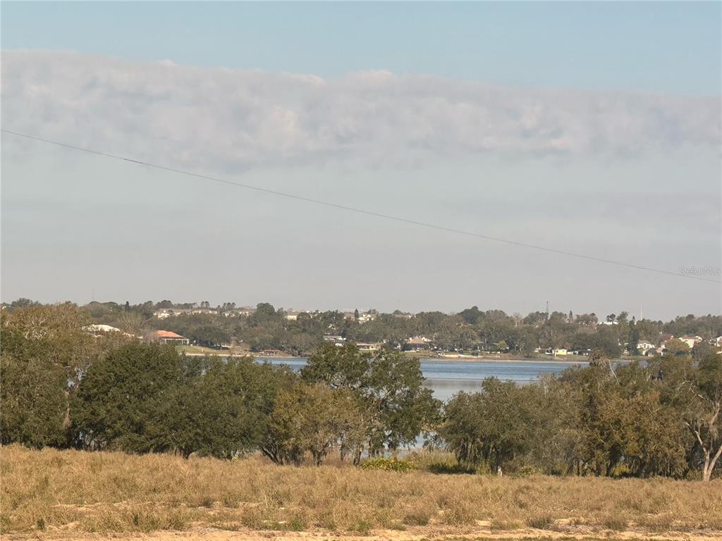 17136 Salty Dog Road Winter Garden, FL 34787 - Photo 32 of 38 a view of a lake and mountain view