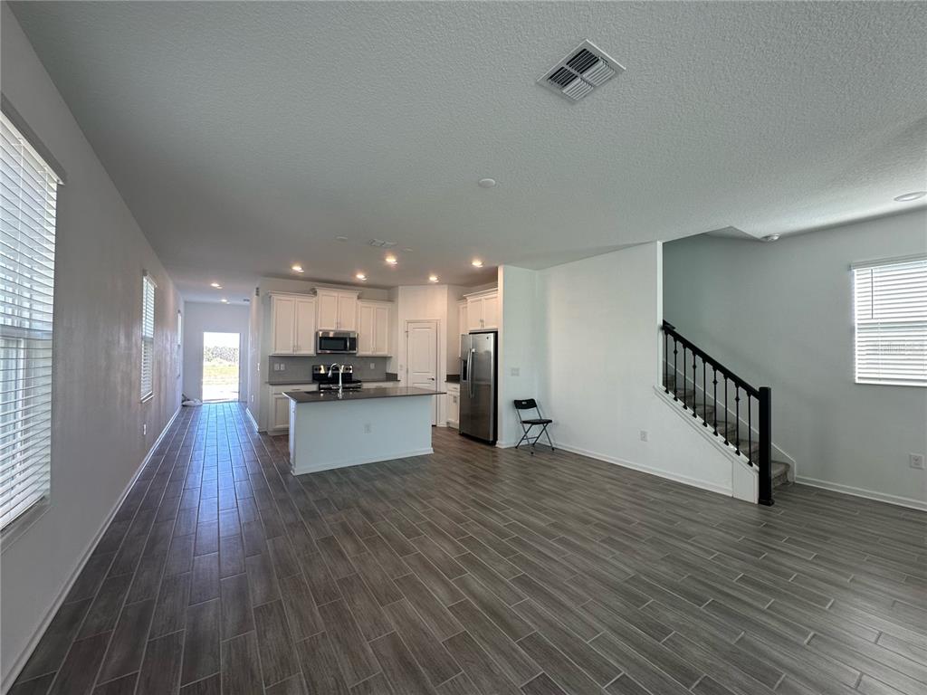 17136 Salty Dog Road Winter Garden, FL 34787 - Photo 6 of 38 a view of kitchen and kitchen with sink wooden floor