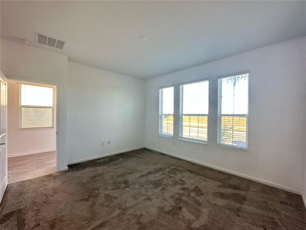 17136 Salty Dog Road Winter Garden, FL 34787 - Photo 8 of 38 an empty room with a window