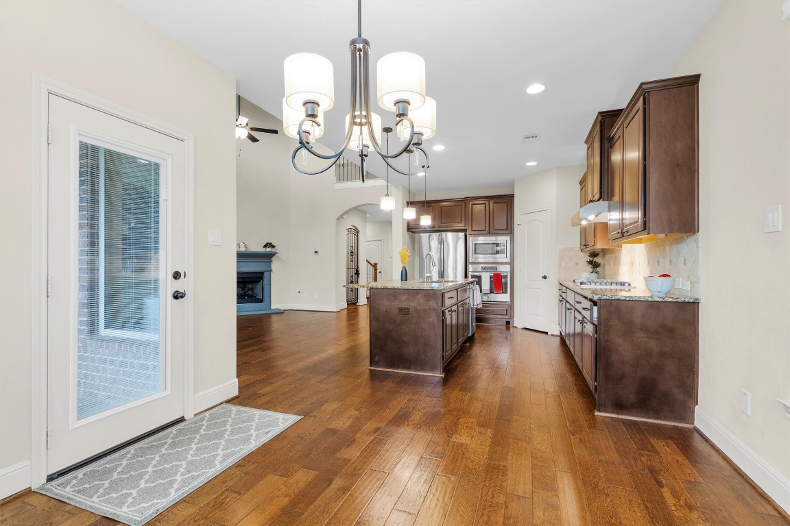 17203 Prairie Falcon Lane Conroe, TX 77385 - Photo 12 of 30 a view of a kitchen and dining room