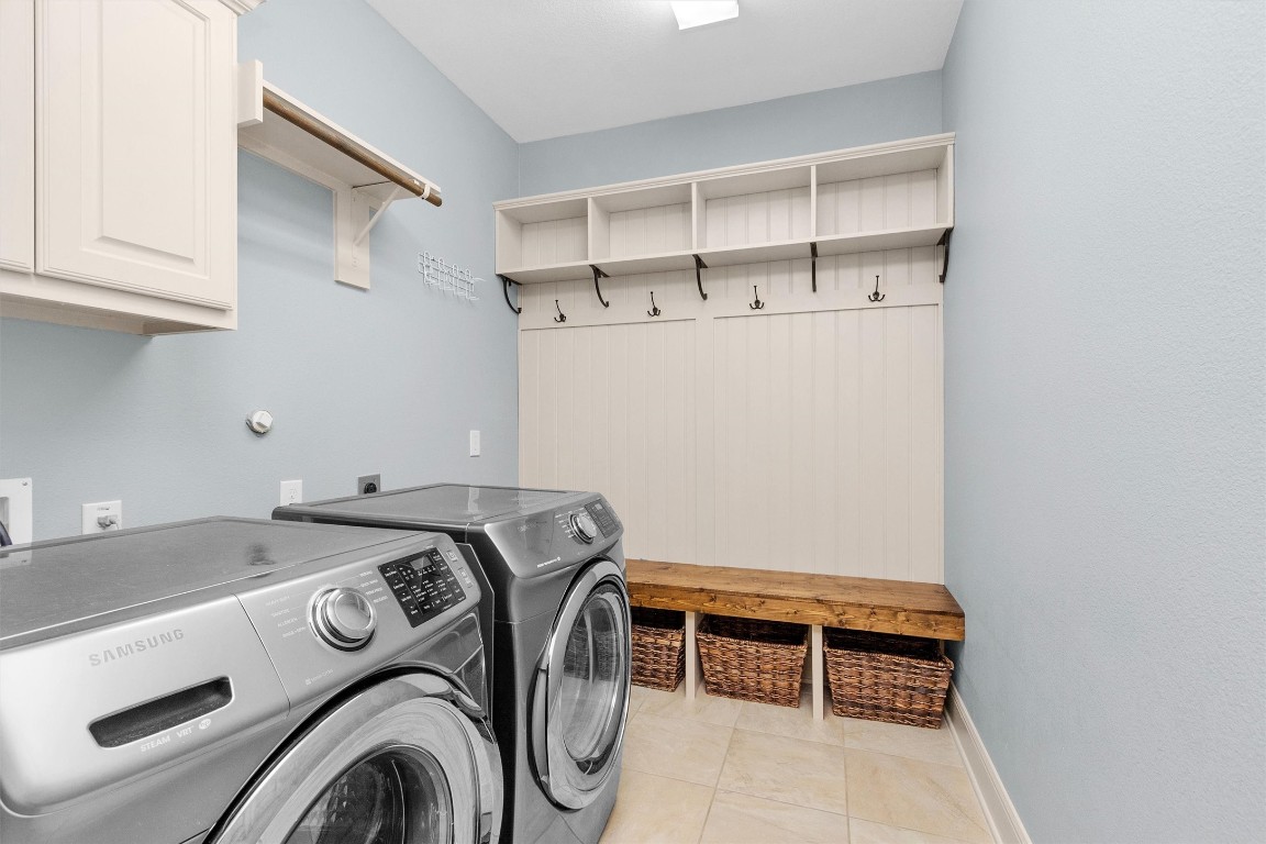 17203 Prairie Falcon Lane Conroe, TX 77385 - Photo 14 of 30 a utility room with dryer and washer