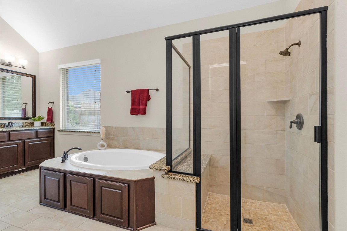 17203 Prairie Falcon Lane Conroe, TX 77385 - Photo 17 of 30 a bathroom with a sink and a mirror