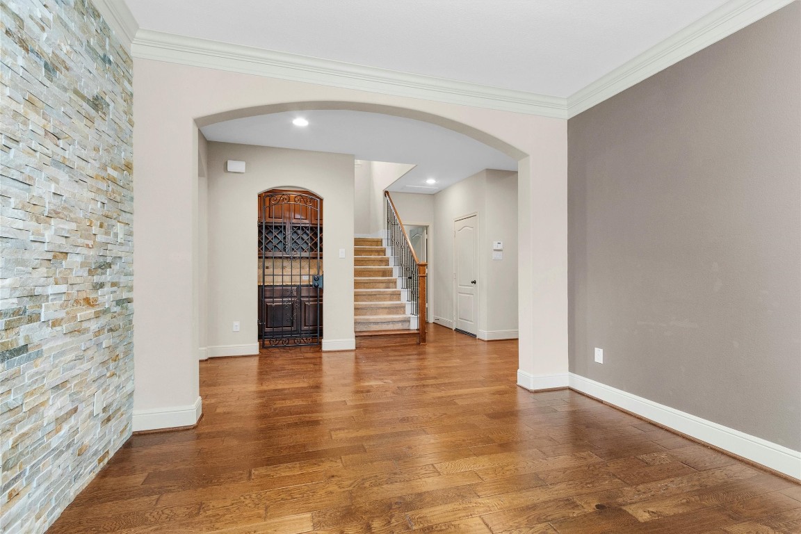 17203 Prairie Falcon Lane Conroe, TX 77385 - Photo 4 of 30 a view of empty room with wooden floor and window