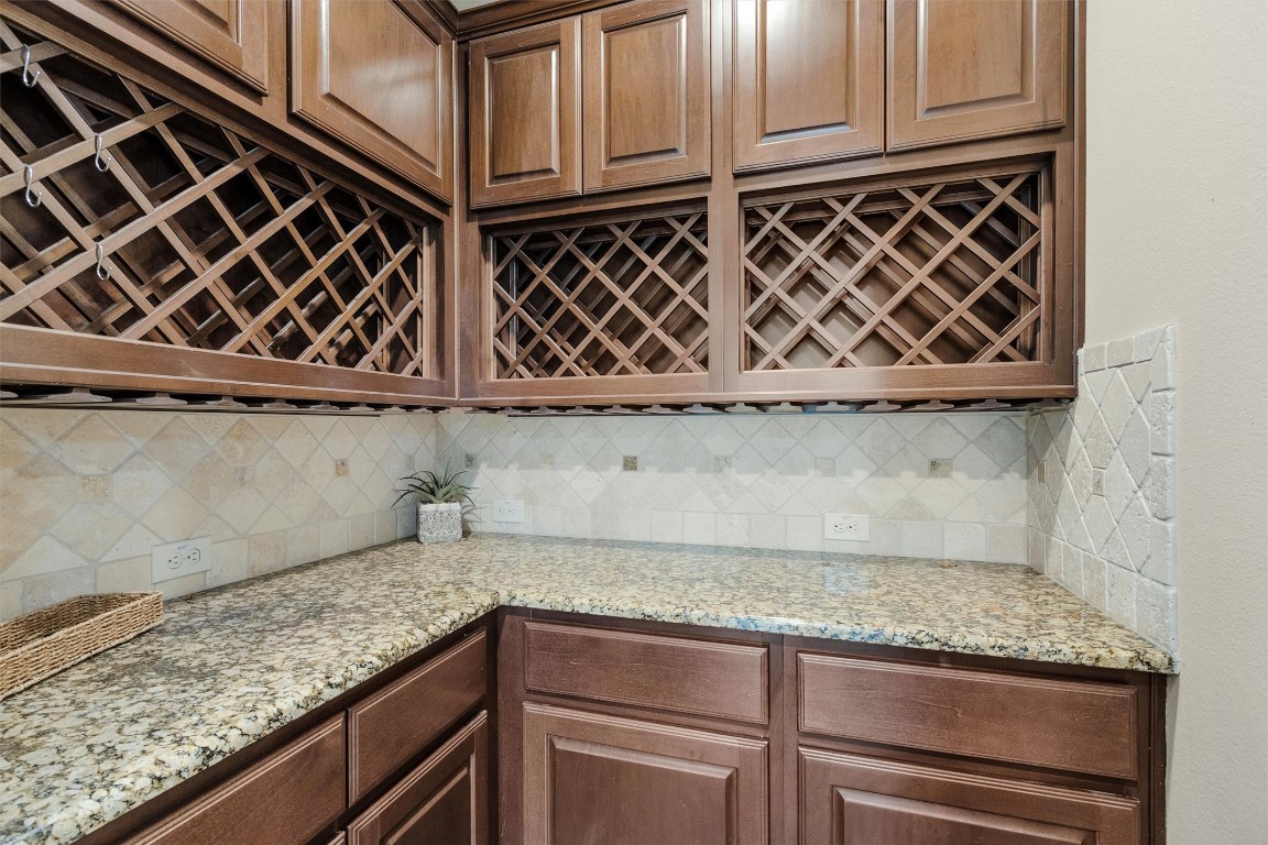 17203 Prairie Falcon Lane Conroe, TX 77385 - Photo 5 of 30 a kitchen with granite countertop cabinets and utility