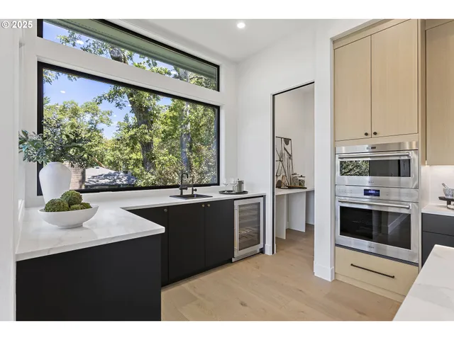 a open kitchen with stainless steel appliances kitchen island a large counter top