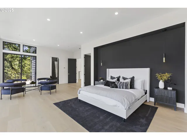 a bed room with a bed and a large window