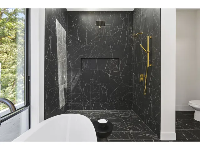 a view of an empty room with a closet