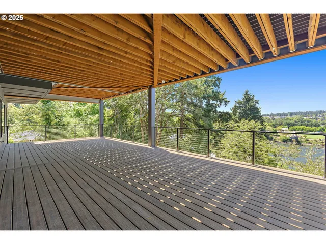 a view of balcony with wooden floor