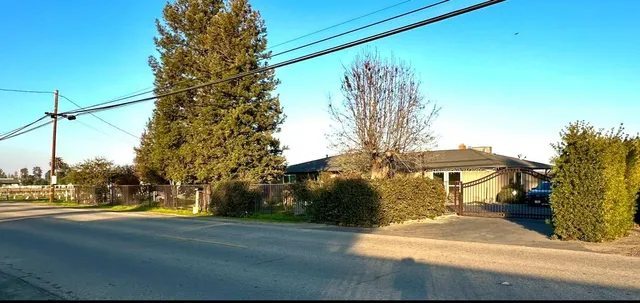 a view of street with houses on both side