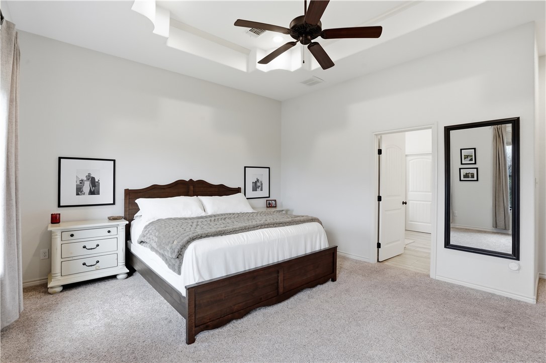 3516 Foxcroft Path Bryan, TX 77808 - Photo 21 of 38 a bedroom with a bed and closet