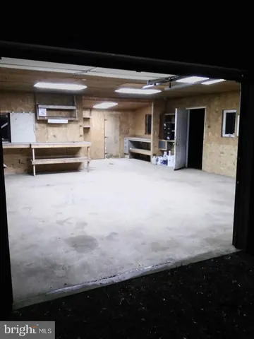 a view of an empty room with a fireplace