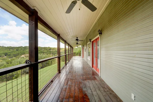 a view of balcony with wooden floor