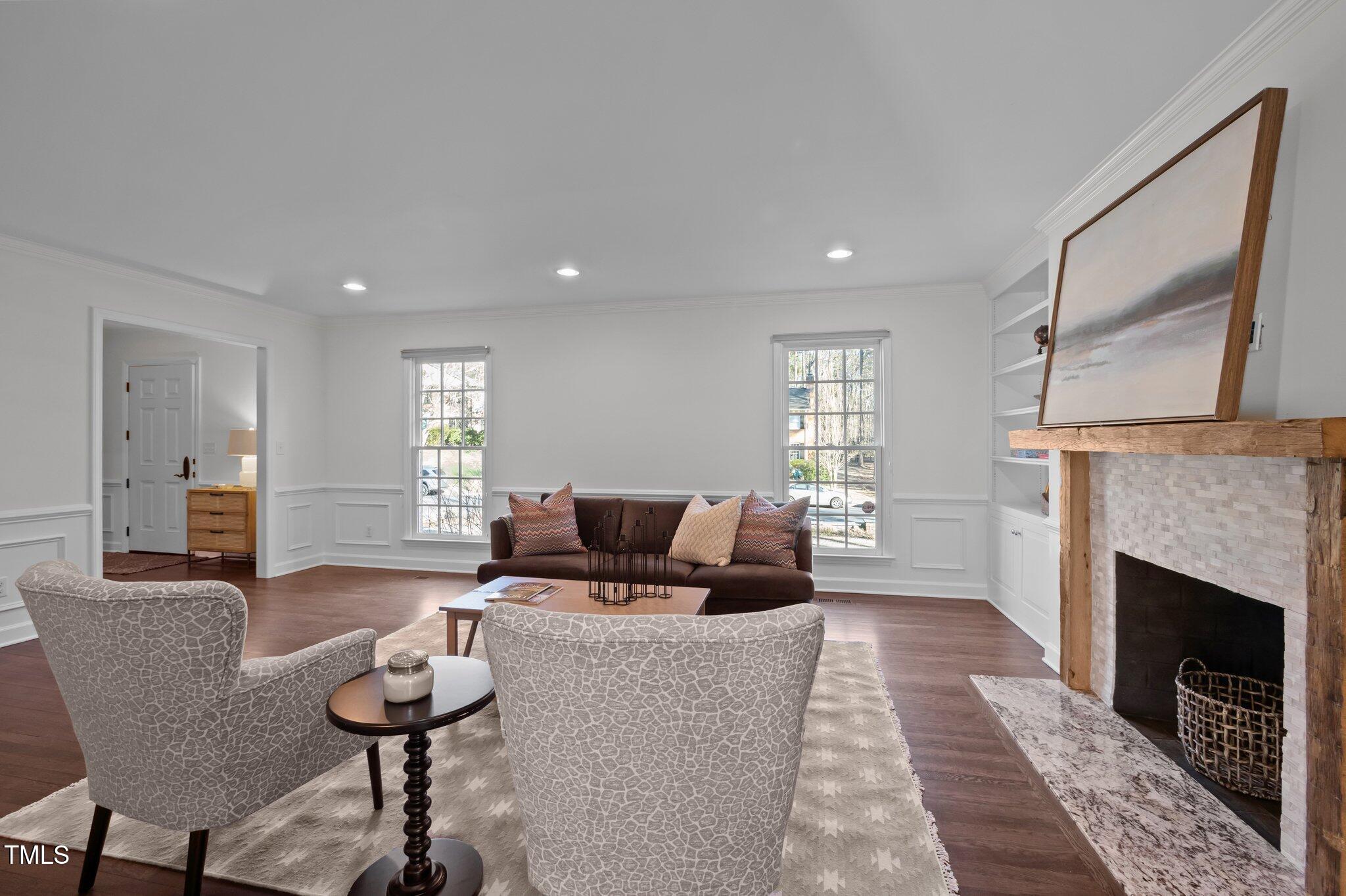 3930 St Marks Road Durham, NC 27707 - Photo 9 of 41 a living room with furniture and a fireplace