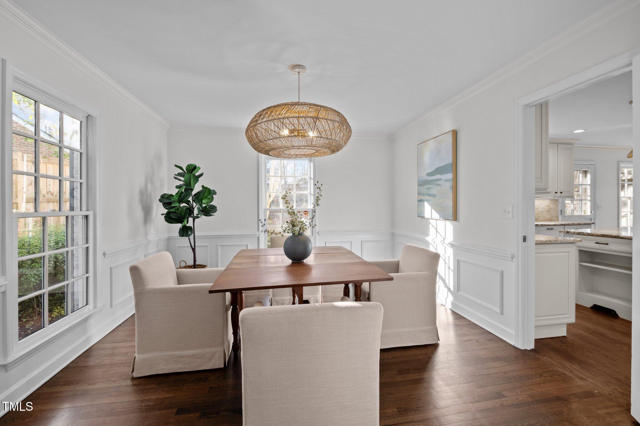 3930 St Marks Road Durham, NC 27707 - Photo 10 of 41 a view of a dining room with furniture and wooden floor