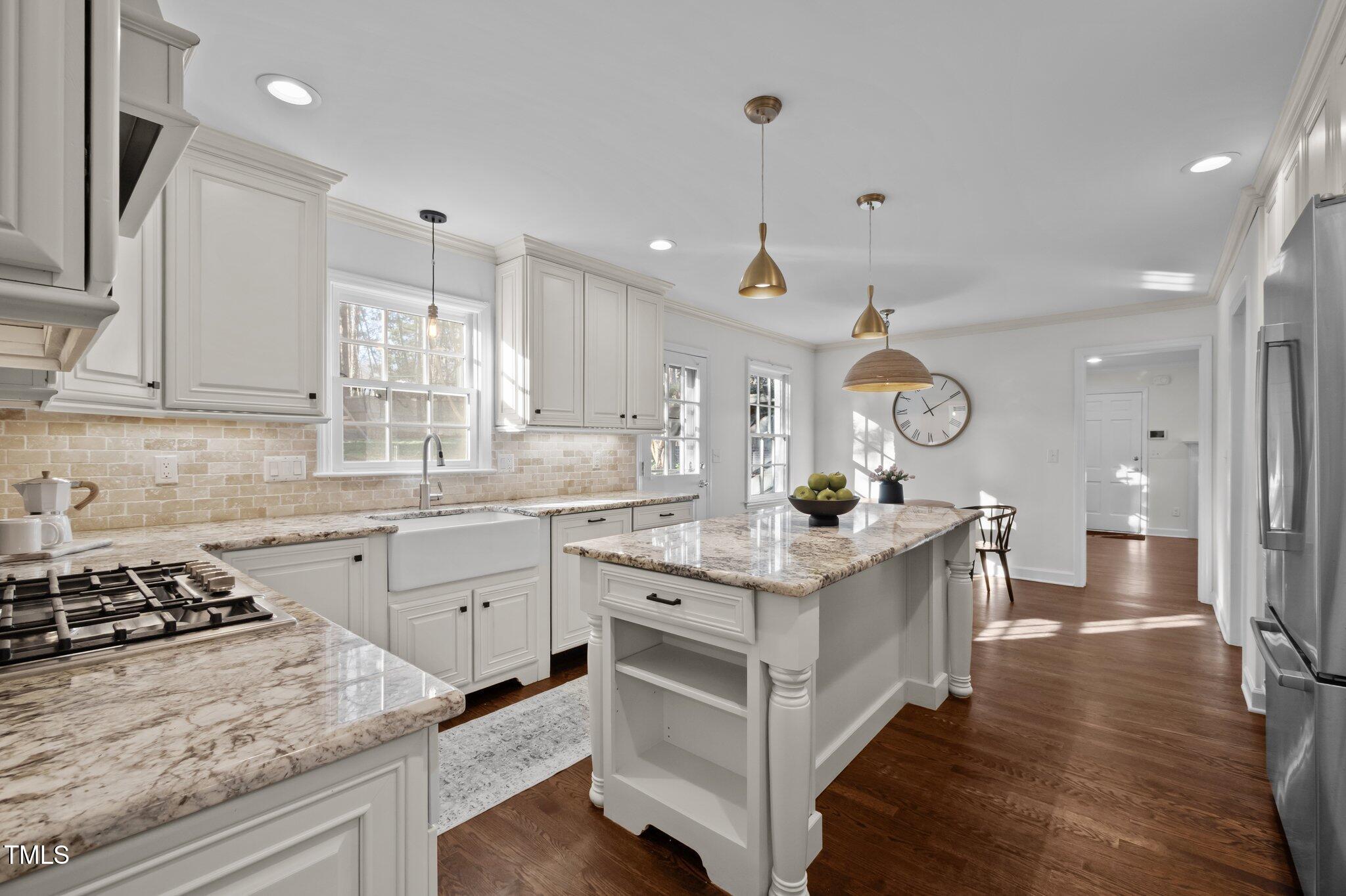 3930 St Marks Road Durham, NC 27707 - Photo 11 of 41 a kitchen with a stove and cabinets