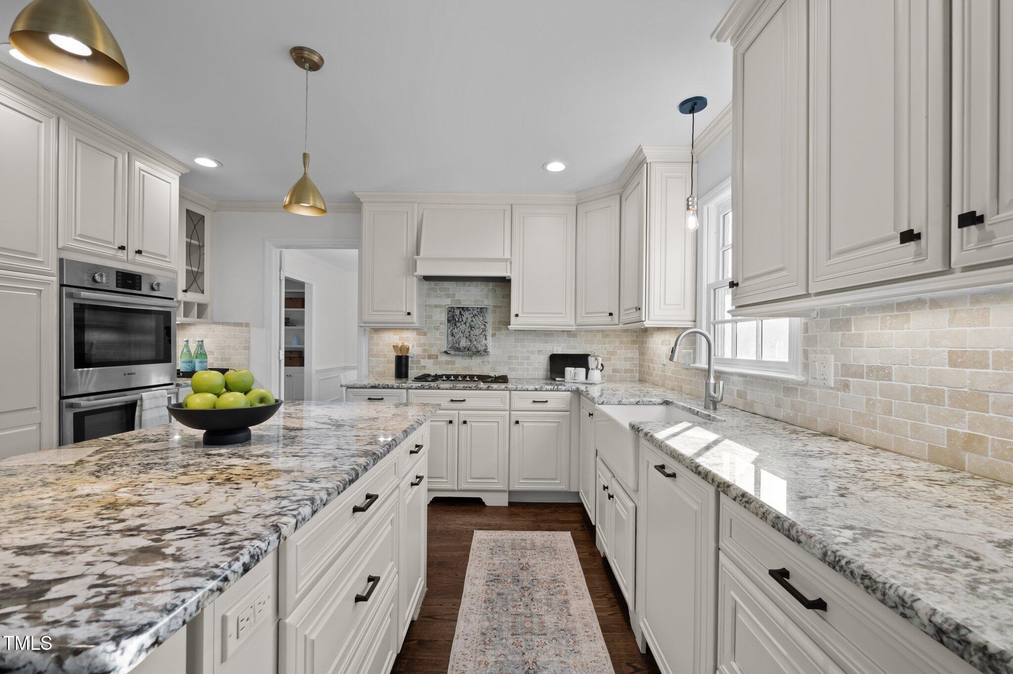 3930 St Marks Road Durham, NC 27707 - Photo 12 of 41 a kitchen with stainless steel appliances granite countertop a sink stove and refrigerator