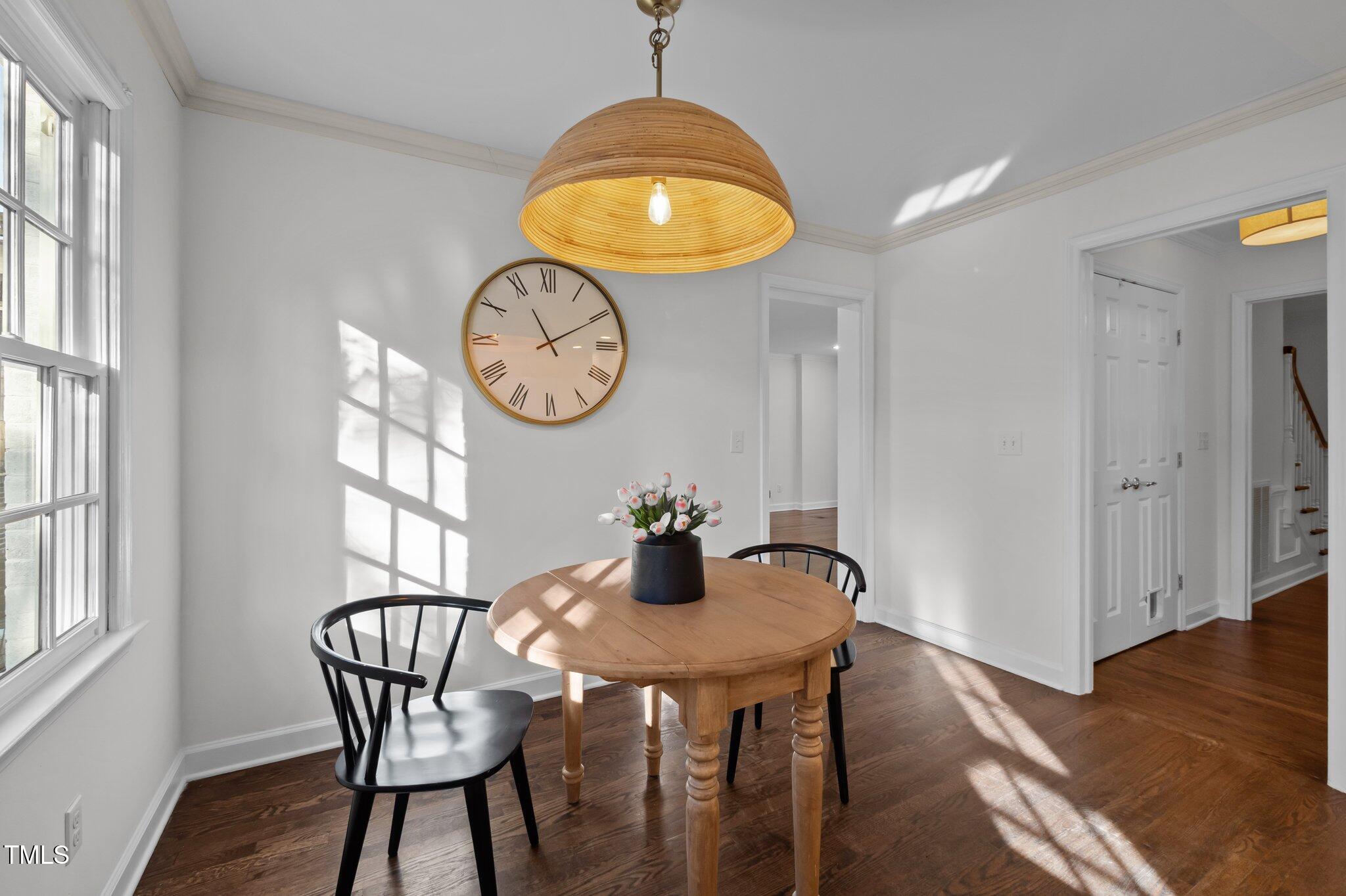 3930 St Marks Road Durham, NC 27707 - Photo 14 of 41 a view of a dining room with furniture and wooden floor