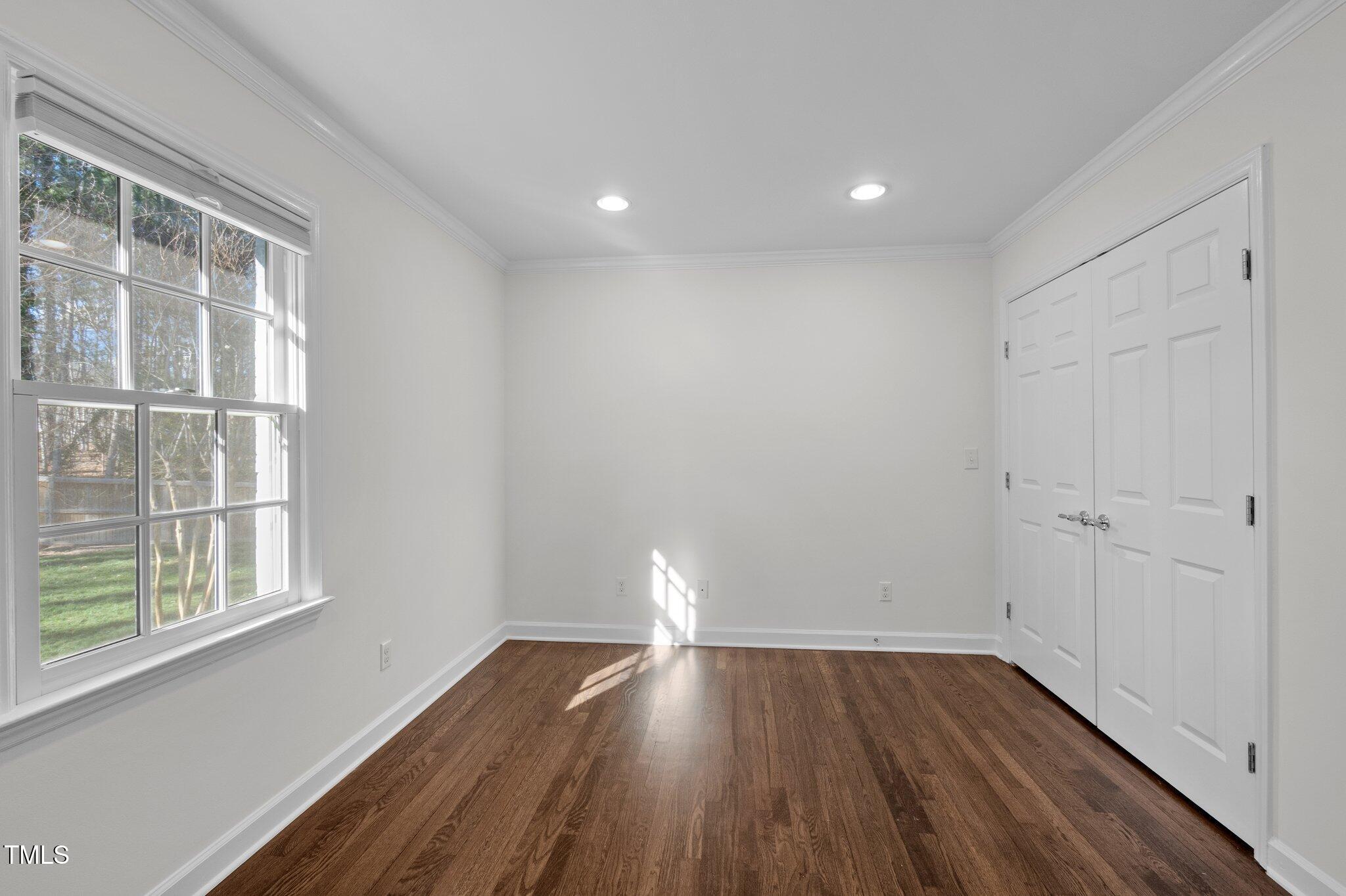 3930 St Marks Road Durham, NC 27707 - Photo 25 of 41 a view of wooden floor and windows in a room