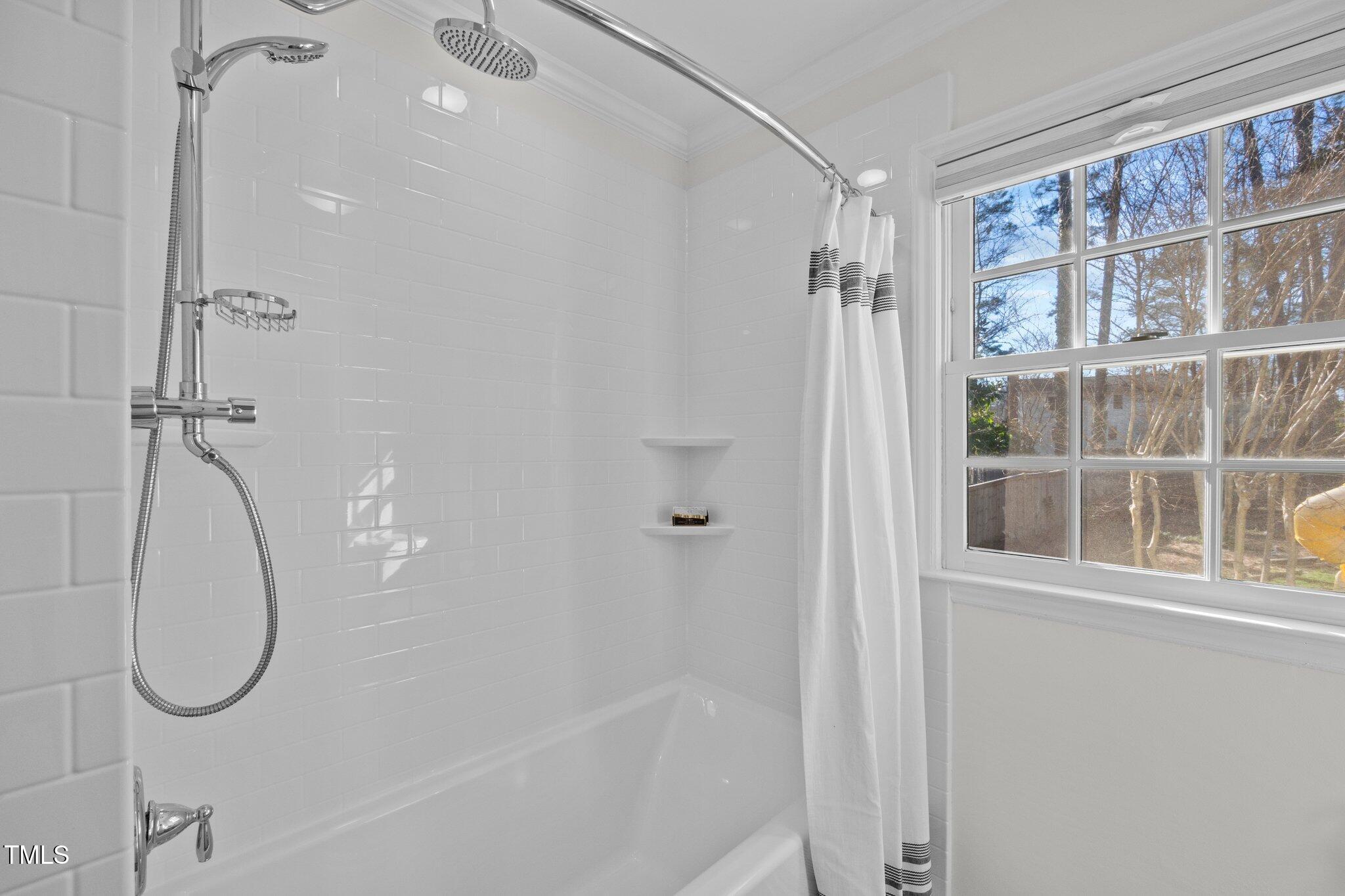 3930 St Marks Road Durham, NC 27707 - Photo 29 of 41 a bathroom with a glass shower door