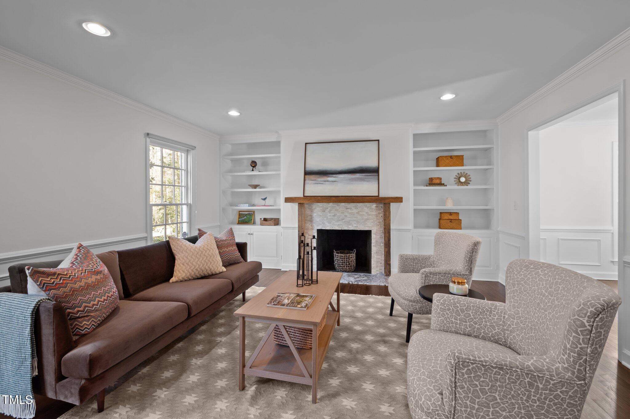 3930 St Marks Road Durham, NC 27707 - Photo 8 of 41 a living room with furniture and a fireplace