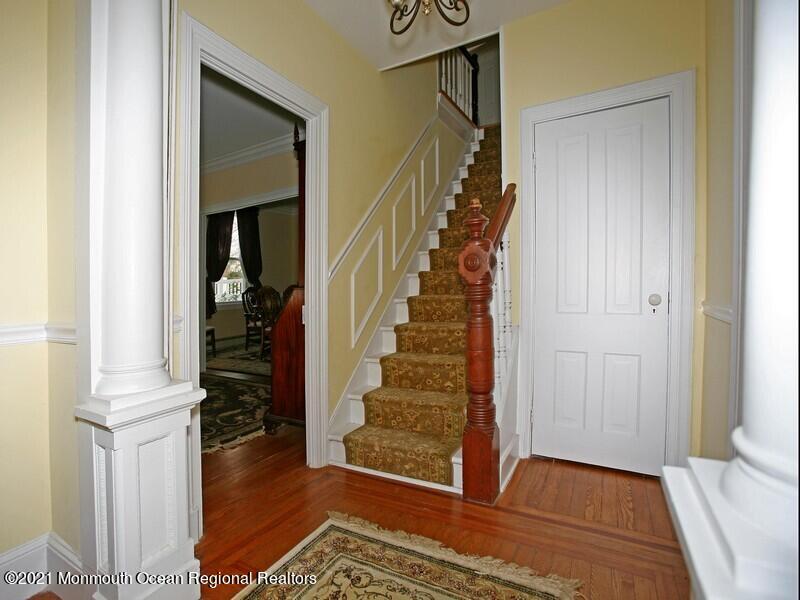 34 Rumson Road Little Silver, NJ 07739 - Photo 12 of 29 a view of entryway with wooden floor and stairs