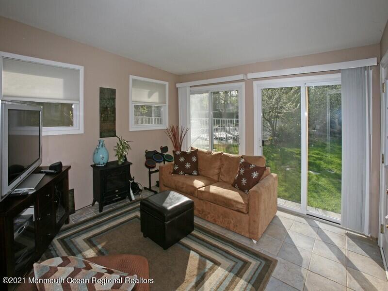 34 Rumson Road Little Silver, NJ 07739 - Photo 13 of 29 a living room with furniture and a flat screen tv