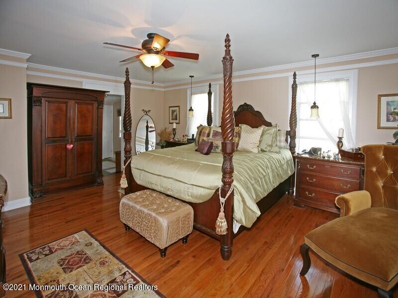 34 Rumson Road Little Silver, NJ 07739 - Photo 14 of 29 a bedroom with a bed mirror and couch