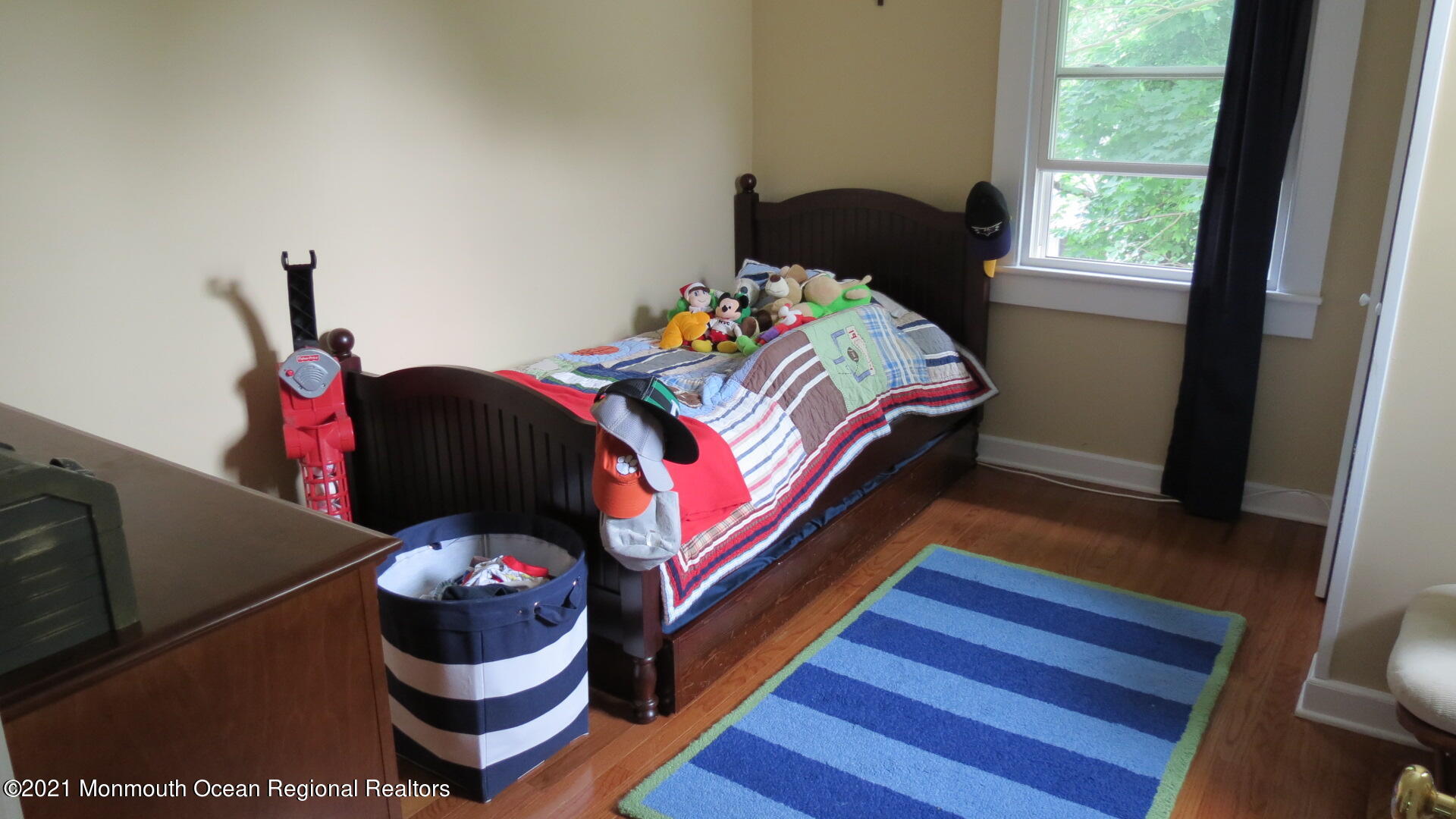 34 Rumson Road Little Silver, NJ 07739 - Photo 16 of 29 a bedroom with a bed and wooden floor