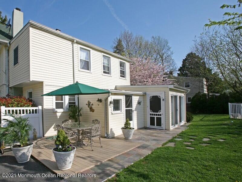 34 Rumson Road Little Silver, NJ 07739 - Photo 18 of 29 a front view of a house with a yard and potted plants
