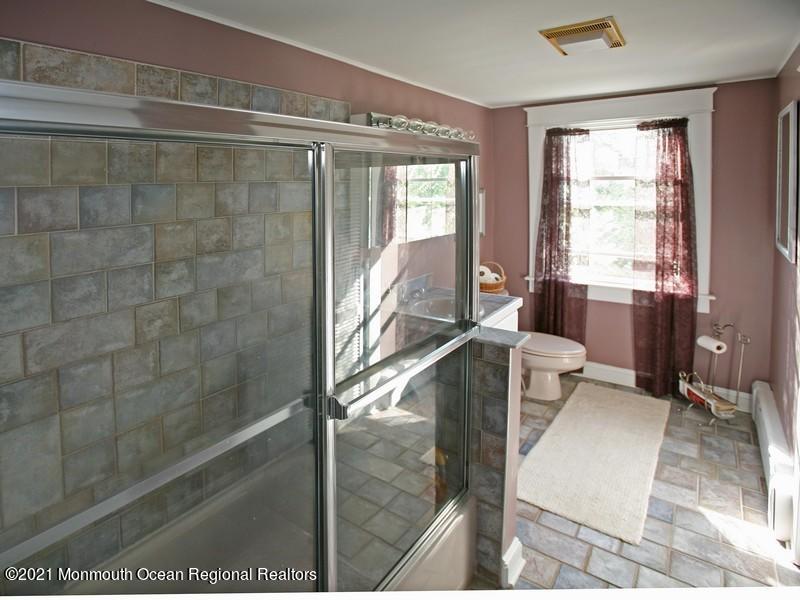 34 Rumson Road Little Silver, NJ 07739 - Photo 19 of 29 a bathroom with a glass shower door