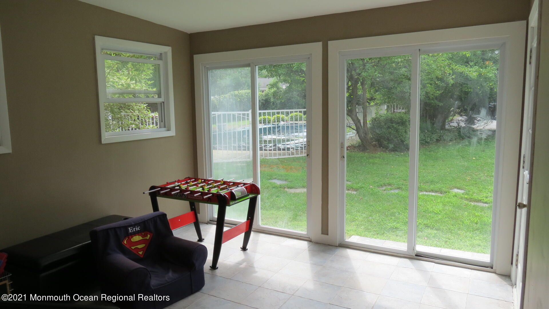 34 Rumson Road Little Silver, NJ 07739 - Photo 24 of 29 a living room with furniture and a floor to ceiling window
