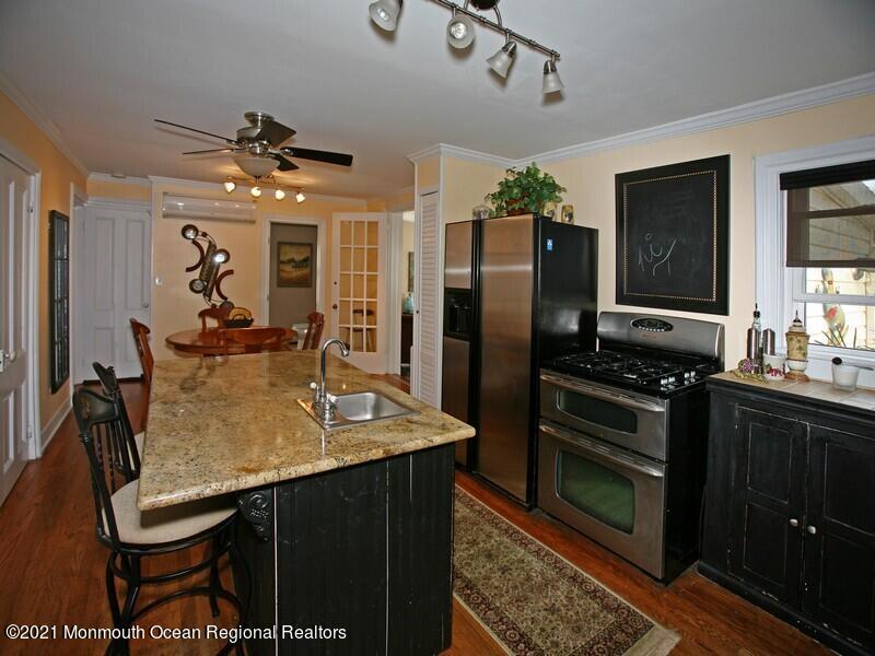 34 Rumson Road Little Silver, NJ 07739 - Photo 6 of 29 a kitchen with stainless steel appliances granite countertop a stove refrigerator and cabinets